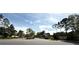 A well-maintained community entrance with landscaping, signage, and controlled access creates an inviting and secure environment at 3664 Wilshire Way Rd # 261, Orlando, FL 32829