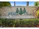 Community sign for Victoria Pines, surrounded by lush greenery and plants at 3664 Wilshire Way Rd # 261, Orlando, FL 32829