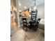 Cozy dining area with a round table, dark wood chairs, and tiled floor at 3664 Wilshire Way Rd # 261, Orlando, FL 32829