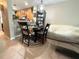 Charming dining area with a round table, dark wood chairs, and tiled floor at 3664 Wilshire Way Rd # 261, Orlando, FL 32829