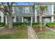 Charming two-story townhouse with inviting entrance and landscaped front yard at 3664 Wilshire Way Rd # 261, Orlando, FL 32829