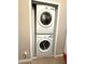 A stacked LG washer and dryer unit is neatly installed in a closet laundry area at 3664 Wilshire Way Rd # 261, Orlando, FL 32829