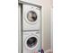 View of stacked LG washer and dryer in a closet at 3664 Wilshire Way Rd # 261, Orlando, FL 32829