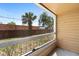 Private balcony with views of nearby palm trees and green space, perfect for relaxation at 4355 Perkinshire Ln # 103, Orlando, FL 32822