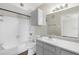Bathroom with a shower and tub combo, large vanity, and updated fixtures for a fresh feel at 4355 Perkinshire Ln # 103, Orlando, FL 32822