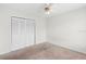 This spacious bedroom features a ceiling fan and a large closet for ample storage at 4355 Perkinshire Ln # 103, Orlando, FL 32822