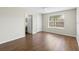 Bedroom boasts wood floors and natural light, offering a peaceful retreat with an adjacent bathroom for added convenience at 4355 Perkinshire Ln # 103, Orlando, FL 32822