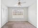 Bright bedroom with a window overlooking the neighborhood, offering a comfortable living space at 4355 Perkinshire Ln # 103, Orlando, FL 32822