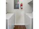 Functional laundry area with modern appliances, electrical panel, and a fire extinguisher at 4355 Perkinshire Ln # 103, Orlando, FL 32822