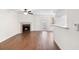 Bright living room features wood floors, fireplace, ceiling fan and sliding doors leading to the outside at 4355 Perkinshire Ln # 103, Orlando, FL 32822