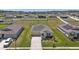 Aerial view of a suburban home in a well-planned community with green lawns at 4718 Magnetite Loop, Mount Dora, FL 32757