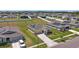 An aerial perspective of a well-planned neighborhood with neatly manicured lawns and sidewalks at 4718 Magnetite Loop, Mount Dora, FL 32757