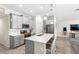 Modern kitchen with stainless steel appliances, white countertops, a center island with seating at 4718 Magnetite Loop, Mount Dora, FL 32757
