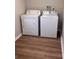 Functional laundry area with a washer and dryer set on durable wood-look floors at 625 Citrus St, Orlando, FL 32805