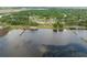 Capture of waterfront homes near a calm lake, featuring docks, and lush surroundings, creating a serene living environment at 720 Basin Dr, Kissimmee, FL 34744