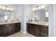 Spacious bathroom with dual vanities with granite counters and recessed lighting at 720 Basin Dr, Kissimmee, FL 34744