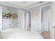 Bedroom featuring tile flooring and multiple doorways offering access to other areas of the home at 720 Basin Dr, Kissimmee, FL 34744