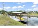 Private boat dock with boat house on canal, offering direct water access at 720 Basin Dr, Kissimmee, FL 34744