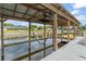 View of the boat lift and dock with a kayak showcasing waterfront living with easy boat access at 720 Basin Dr, Kissimmee, FL 34744