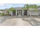 Charming single-story home featuring well-manicured landscaping and an inviting screened porch entrance at 720 Basin Dr, Kissimmee, FL 34744