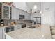 Contemporary kitchen featuring stainless steel appliances, wine storage, and granite countertops at 720 Basin Dr, Kissimmee, FL 34744