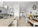 Open concept kitchen with granite counters, island seating, and open view of living spaces at 720 Basin Dr, Kissimmee, FL 34744