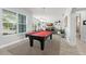 Bright recreation area featuring billiard table, plenty of light, and tile flooring at 720 Basin Dr, Kissimmee, FL 34744