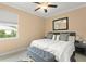 Tranquil main bedroom with a tufted bench, soft lighting, and a peaceful atmosphere at 720 Basin Dr, Kissimmee, FL 34744