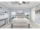 Serene main bedroom with a tray ceiling and stylish decor, creating a relaxing retreat at 720 Basin Dr, Kissimmee, FL 34744