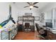 Cozy office with stylish decor, hardwood floors, and ample storage space at 720 Basin Dr, Kissimmee, FL 34744