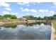 Scenic water view showcasing the calm canal and peaceful neighborhood surroundings at 720 Basin Dr, Kissimmee, FL 34744