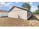 Backyard with block fence and limited landscaping at 7435 Groveoak Dr, Orlando, FL 32810