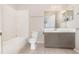 Clean bathroom with a shower-tub combo, classic vanity, and tiled flooring at 7435 Groveoak Dr, Orlando, FL 32810