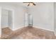 Bedroom featuring light-colored walls, carpet, and closet space at 7435 Groveoak Dr, Orlando, FL 32810