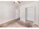 A simple bedroom with light-colored walls and carpet at 7435 Groveoak Dr, Orlando, FL 32810