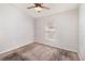Standard bedroom with carpet, white walls, a ceiling fan and a window at 7435 Groveoak Dr, Orlando, FL 32810