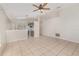 Spacious living room and kitchen combo with tile flooring and abundant natural light at 7435 Groveoak Dr, Orlando, FL 32810