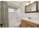 Bathroom with a bathtub and shower combination, vanity, and a framed mirror at 769 Little Wekiva Cir, Altamonte Springs, FL 32714