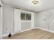 Bedroom featuring hardwood floors, neutral paint, and a window with curtains at 769 Little Wekiva Cir, Altamonte Springs, FL 32714