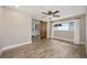 Stylish bedroom features a sliding barn door and ample natural light at 769 Little Wekiva Cir, Altamonte Springs, FL 32714