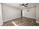 Minimalist bedroom with wood floors, a ceiling fan and recessed lights at 769 Little Wekiva Cir, Altamonte Springs, FL 32714