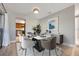 Bright dining area with contemporary furnishings, perfect for Gathering meals and entertaining guests at 769 Little Wekiva Cir, Altamonte Springs, FL 32714