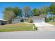 Charming single-story home with a well-manicured lawn and two car garage at 769 Little Wekiva Cir, Altamonte Springs, FL 32714