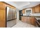 Modern kitchen with stainless steel appliances, granite countertops, and light wood cabinetry at 769 Little Wekiva Cir, Altamonte Springs, FL 32714