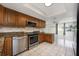 Spacious kitchen featuring wooden cabinets, stainless steel appliances, and ample counter space at 769 Little Wekiva Cir, Altamonte Springs, FL 32714