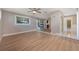 Spacious living area with hardwood floors, a ceiling fan, and sliding glass doors at 769 Little Wekiva Cir, Altamonte Springs, FL 32714