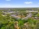 Aerial view of community featuring well maintained landscape and pond with water feature at 8217 Sun Spring Cir # 41, Orlando, FL 32825
