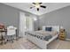 Bright bedroom with tile flooring, ceiling fan, and a desk and chair set up at 8217 Sun Spring Cir # 41, Orlando, FL 32825