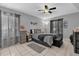 Cozy bedroom featuring cool gray walls, tile flooring, and a ceiling fan at 8217 Sun Spring Cir # 41, Orlando, FL 32825