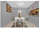 Well-lit dining area with tile flooring and decorative touches, perfect for entertaining at 8217 Sun Spring Cir # 41, Orlando, FL 32825